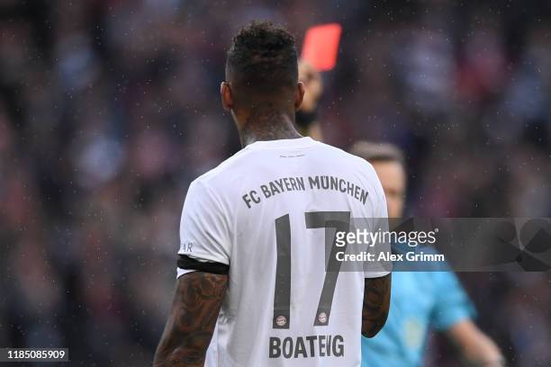 Referee Markus Schmidt sghows the red card to Jerome Boateng of Muenchen during the Bundesliga match between Eintracht Frankfurt and FC Bayern...