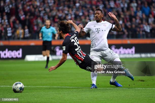 Jerome Boateng of FC Bayern Munich tackles Goncalo Paciencia of Eintracht Frankfurt which leads to a red card for Jerome Boateng during the...
