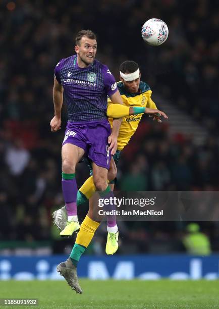 Christian Doidge of Hibernian battles for possession with Christopher Jullien of Celtic during the Betfred Cup Semi-Final match between Hibernan and...