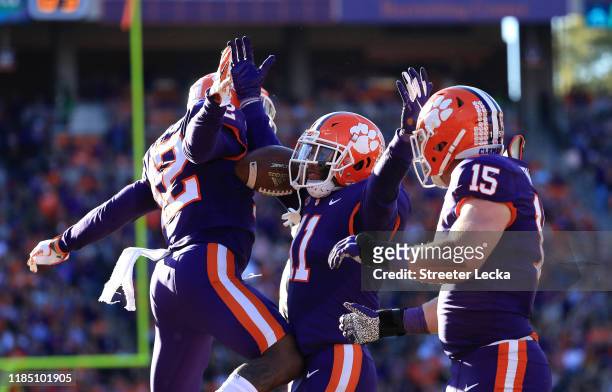 Isaiah Simmons of the Clemson Tigers celebrates with teammates after an interception against the Wofford Terriers during their game at Memorial...