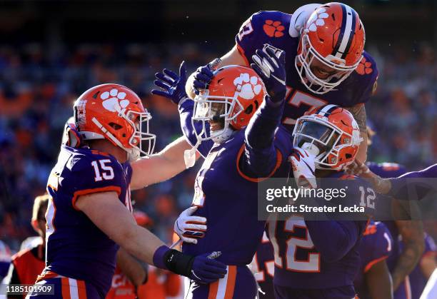 Isaiah Simmons of the Clemson Tigers celebrates with teammates after an interception against the Wofford Terriers during their game at Memorial...