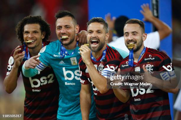 Willian Arao, Diego Alves, Diego Ribas and Everton Ribeiro during the trophy ceremony after winning the Brasileirao 2019 after the match against...