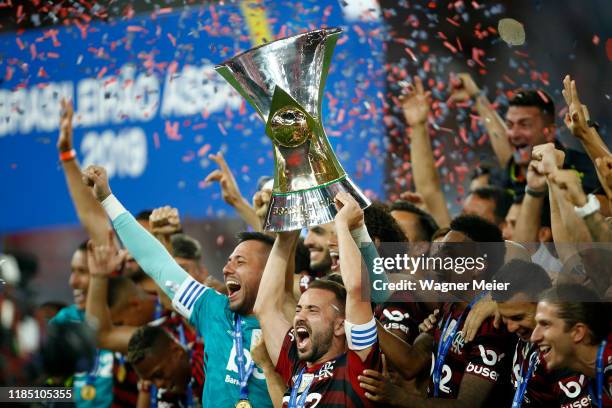 Flamengo captain Everton Ribeiro holds the trophy after winning the Brasileirao 2019 after the match against Ceará at Maracana Stadium on November...