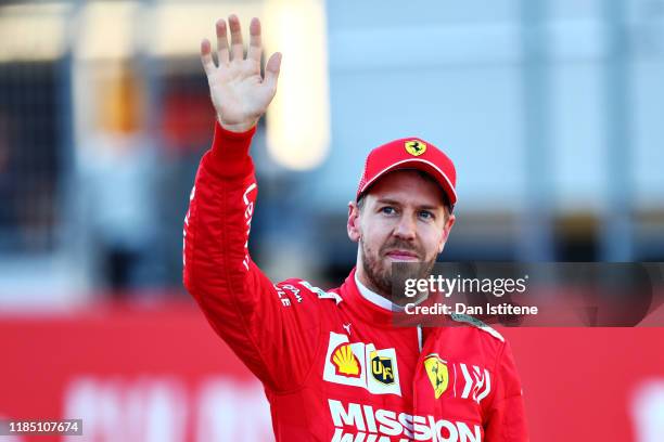 Second place qualifier Sebastian Vettel of Germany and Ferrari celebrates in parc ferme during qualifying for the F1 Grand Prix of USA at Circuit of...