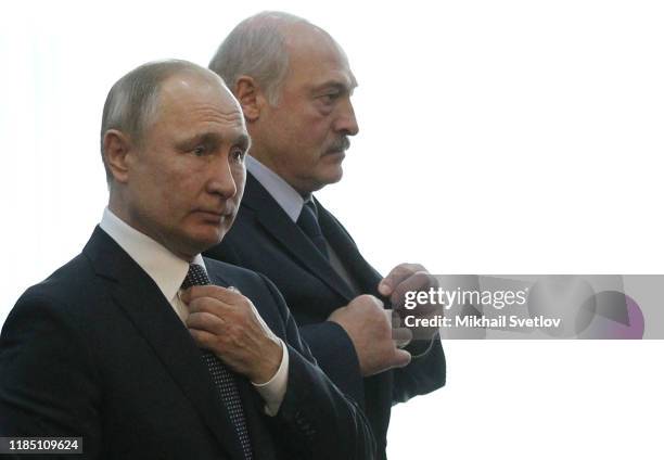 Russian President Vladimir Putin and Belarussian President Alexander Lukashenko enter the hall during the Collective Security Treaty Organization...