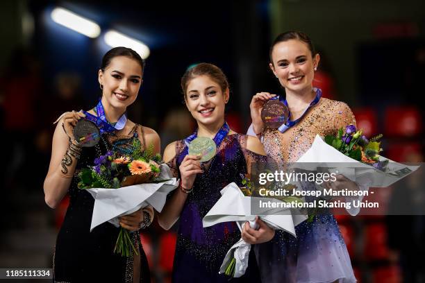 Alina Zagitova of Russia, Alena Kostornaia of Russia and Mariah Bell of the United States pose in the Ladies medal ceremony during day 2 of the ISU...