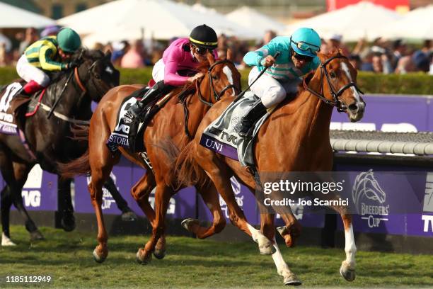 Joel Rosario riding Uni crosses the finish line of the Breeders' Cup Mile at Santa Anita Park on November 02, 2019 in Arcadia, California.