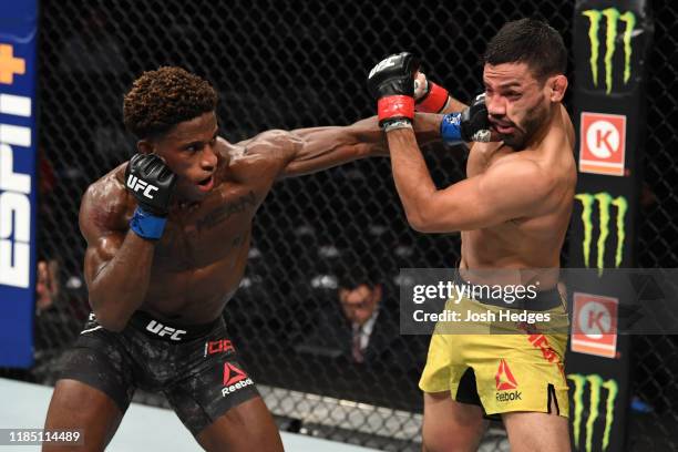 Hakeem Dawodu of Canada punches Julio Arce in their featherweight bout during the UFC 244 event at Madison Square Garden on November 02, 2019 in New...