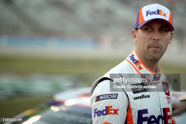 Denny Hamlin, driver of the FedEx Office Toyota, looks on during the Salute to Veterans Qualifying Day Fueled by The Texas Lottery for the Monster...