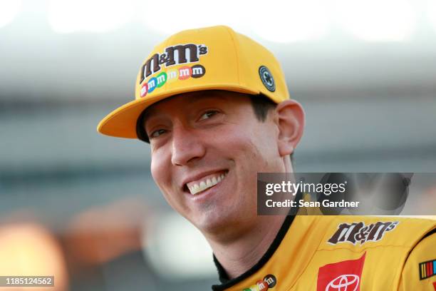 Kyle Busch, driver of the M&M's Toyota, stands on the grid during the Salute to Veterans Qualifying Day Fueled by The Texas Lottery for the Monster...