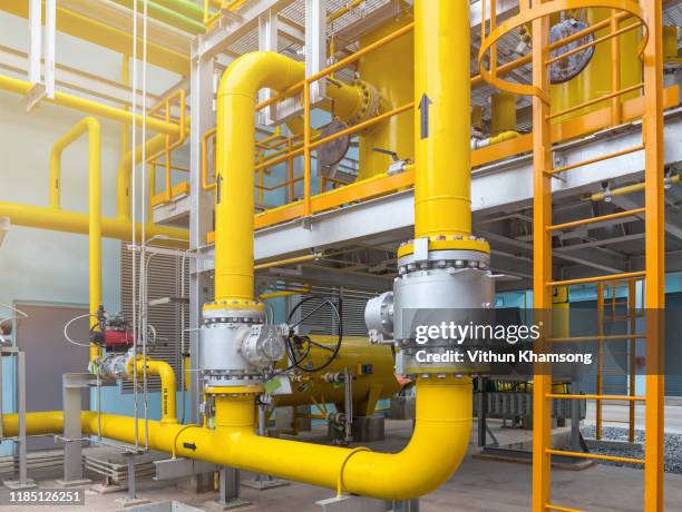 gas metering station and pipeline at power plant of industrial zone - house warm heating oil stockfoto's en -beelden