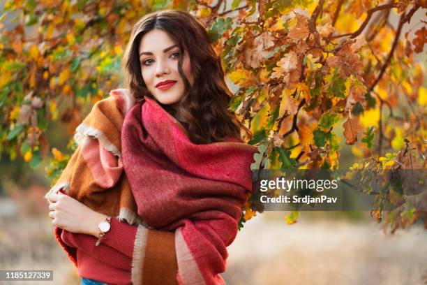 colorful season - woman in a shawl stock pictures, royalty-free photos & images