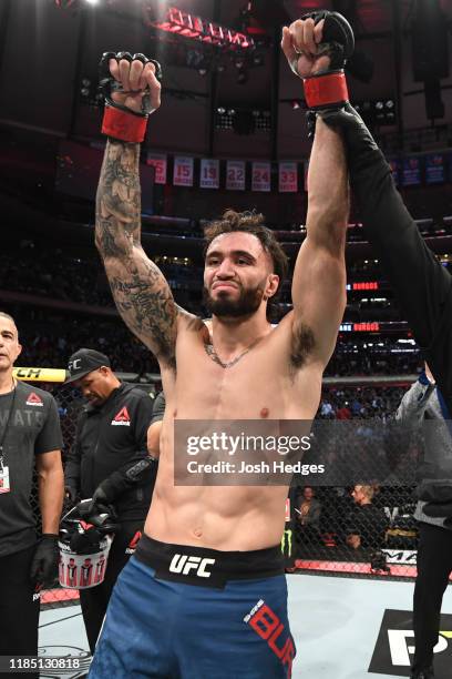 Shane Burgos celebrates his TKO victory over Makwan Amirkhani of Finland in their featherweight bout during the UFC 244 event at Madison Square...