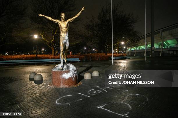 The fire-damaged statue of the Swedish football player Zlatan Ibrahimovic is pictured in Malmoe, November 27, 2019. - The statue was set alight after...