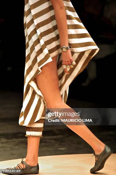 This is a clothes' detail on a model who walks the catwalk for the House of Carlota Joaquina, 20 June 2001, during the Sao Paulo Fashion week,...