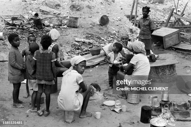 Families cook in the devasted streets of Luanda, on September 4, 1975 during the Angolan Civil War between 1975 and 2002.