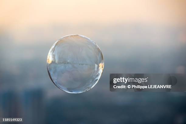 soap bubble against city aerial view - water sphere stock pictures, royalty-free photos & images