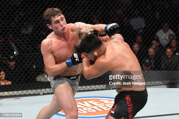 Darren Till of England punches Kelvin Gastelum in their middleweight bout during the UFC 244 event at Madison Square Garden on November 02, 2019 in...