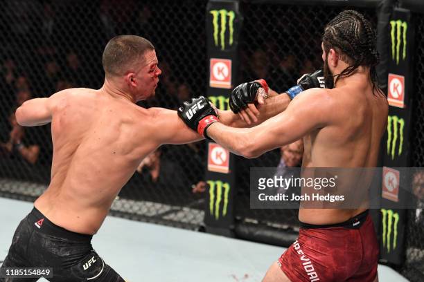 Nate Diaz punches Jorge Masvidal in their welterweight bout for the BMF title during the UFC 244 event at Madison Square Garden on November 02, 2019...