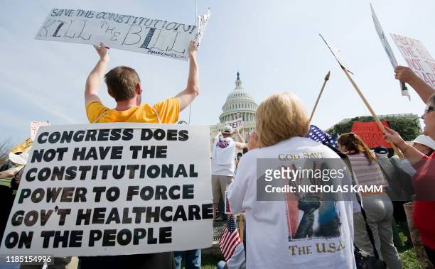 Supporters of the Tea Party movement demonstrate outside the US Capitol in Washington on March 21, 2010 against the health care bill. The US House of...