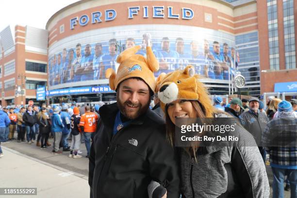 Detroit Lions fans pose for a photo outside of Ford Field prior to the NFL, Thanksgiving Day game between the Detroit Lions and the Chicago Bears on...