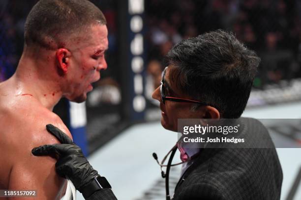 The doctor interacts with Nate Diaz between rounds of his welterweight bout against Jorge Masvidal for the BMF title during the UFC 244 event at...