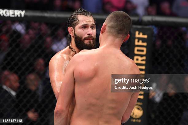 Jorge Masvidal and Nate Diaz interact after the doctor's stoppage in their welterweight bout for the BMF title during the UFC 244 event at Madison...