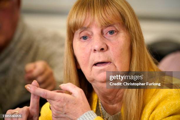 Margaret Aspinall, whose 18-year-old son James was killed in the disaster, looks down during a press conference at the Cunard Building after former...