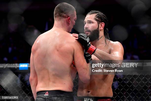 Jorge Masvidal of the United States speaks to Nate Diaz of the United States after he is awarded victory by TKO on a medical stoppage against in the...