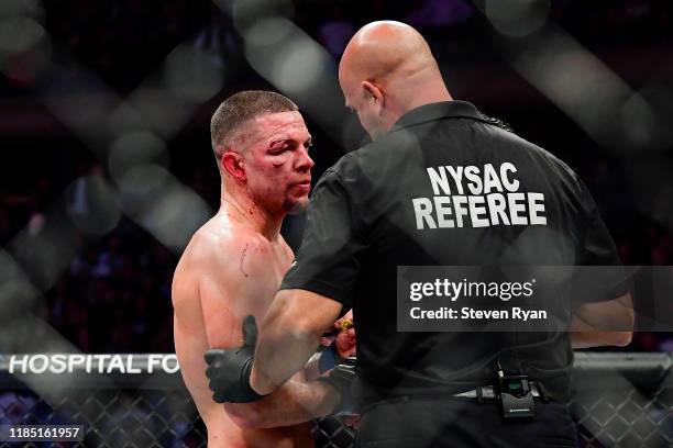 Nate Diaz of the United States is told the fight has been called off by TKO on a medical stoppage against Jorge Masvidal of the United States in the...
