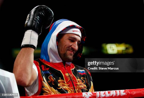 Sergey Kovalev raises his glove as he is introduced for his WBO light heavyweight title defense against Canelo Alvarez at MGM Grand Garden on...