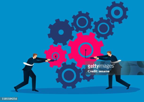 two businessmen work together to make the gears work - turning key stock illustrations