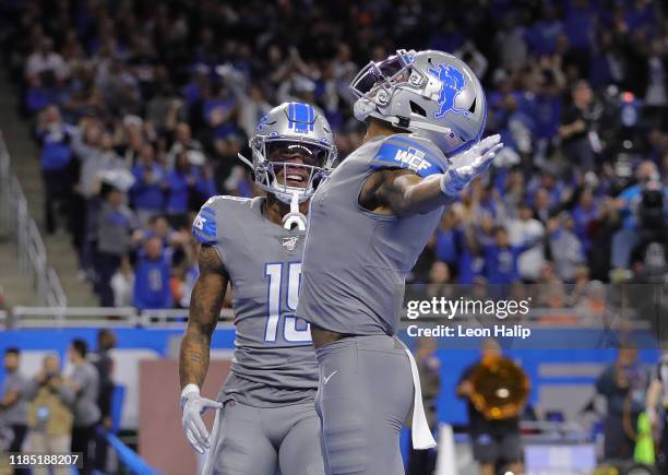 Marvin Jones of the Detroit Lions celebrates a first quarter touchdown with teammate Kenny Golladay during the first quarter of the game against the...