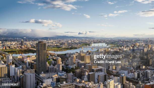 aerial sunrise view of osaka city in japan - kinki stockfoto's en -beelden