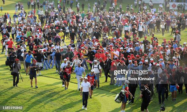 Rory McIlroy of Northern Ireland makes his way on to the 18th green during the final round of the WGC HSBC Champions at Sheshan International Golf...