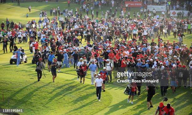 Rory McIlroy of Northern Ireland makes his way on to the 18th green during the final round of the WGC HSBC Champions at Sheshan International Golf...