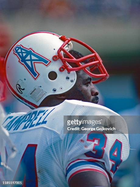 Running back Earl Campbell of the Houston Oilers looks on from the sideline during a game against the Pittsburgh Steelers at Three Rivers Stadium on...