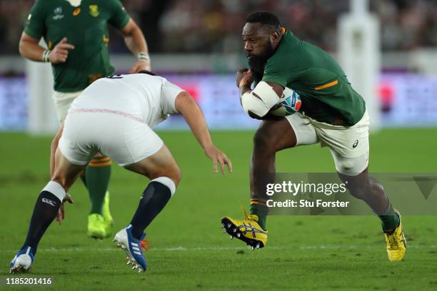 South Africa player Tendai Mtawarira runs at the England defence during the Rugby World Cup 2019 Final between England and South Africa at...