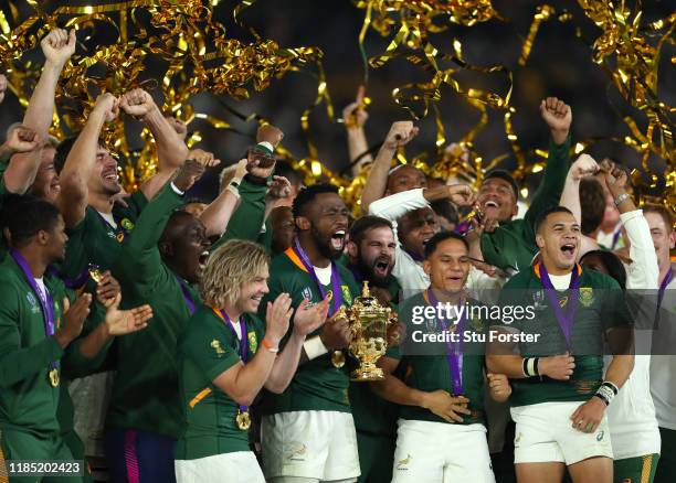 South Africa captain Siya Kolisi lifts the trophy with his team mates Faf de Klerk Herschel Jantjies and Cheslin Kolbe after the Rugby World Cup 2019...