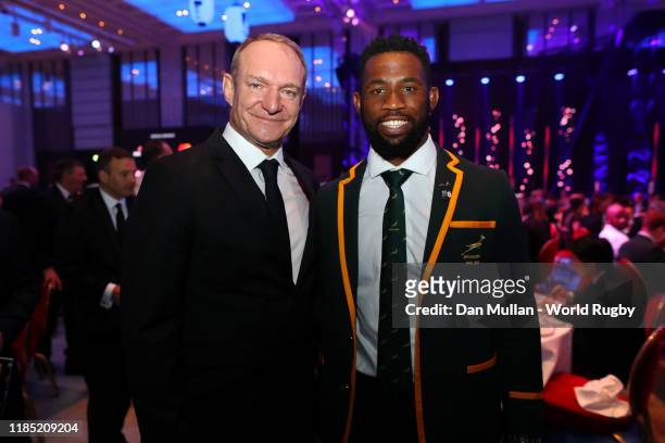 Winning South African Captain Francois Pienaar congratulates new World Champion South African captain Siya Kolisi during the World Rugby Awards 2019...