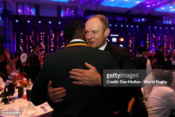 Winning South African Captain Francois Pienaar congratulates new World Champion South African captain Siya Kolisi during the World Rugby Awards 2019...
