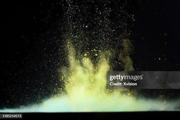 dancing powder color with black background captured with high speed sync. - flour dust stock pictures, royalty-free photos & images