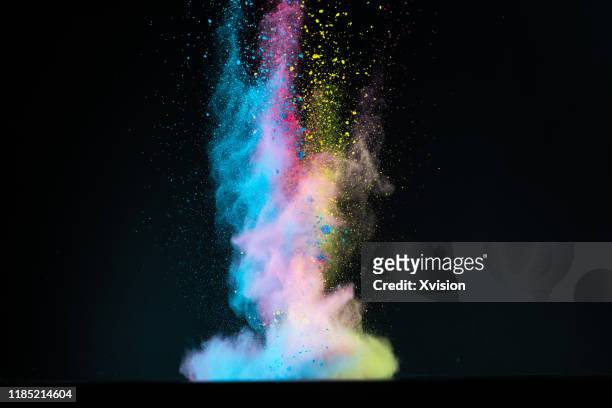 dancing powder color with black background captured with high speed sync. - black powder stock-fotos und bilder