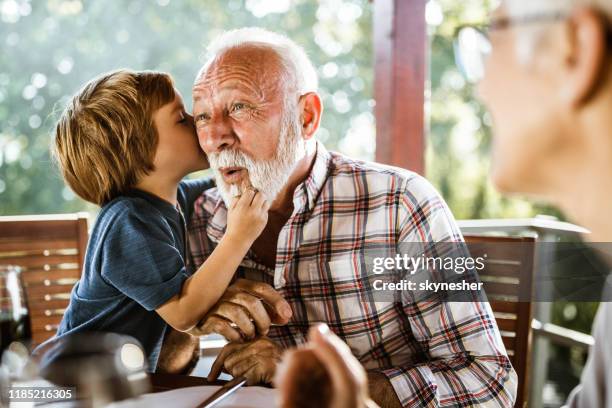 ik zal je iets granddad fluisteren! - private terrace balcony stockfoto's en -beelden