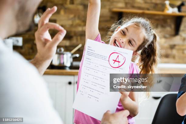 yay daddy, i've got an a on my exam! - test results stock pictures, royalty-free photos & images