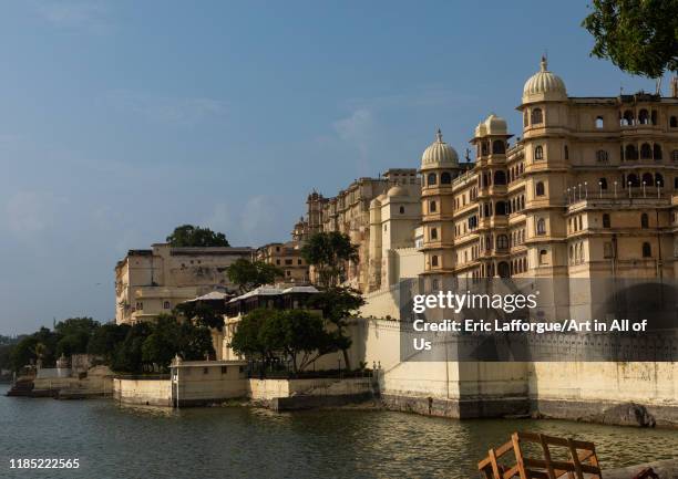 The city palace alongside lake Pichola, Rajasthan, Udaipur, India on July 18, 2019 in Udaipur, India.