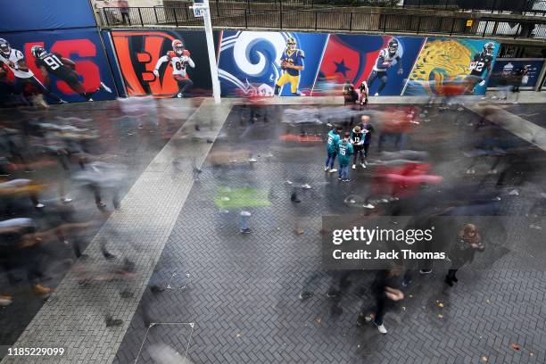 Fans arrive at the stadium prior to the NFL match between the Houston Texans and Jacksonville Jaguars at Wembley Stadium on November 03, 2019 in...