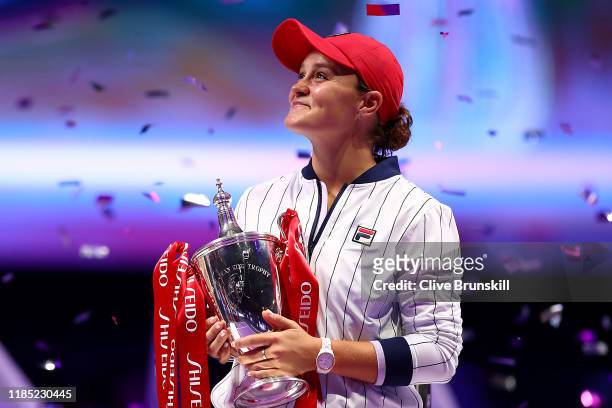 Ashleigh Barty of Australia celebrates with the Billie Jean King trophy after her Women's Singles final match victory against Elina Svitolina of...