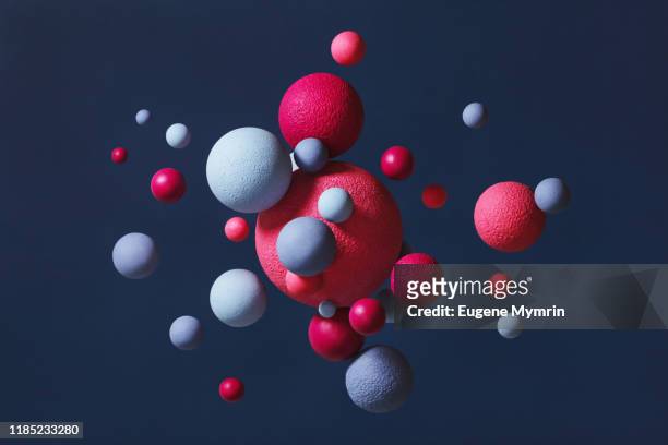 abstract multi-colored spheres on blue background - sphere stock pictures, royalty-free photos & images