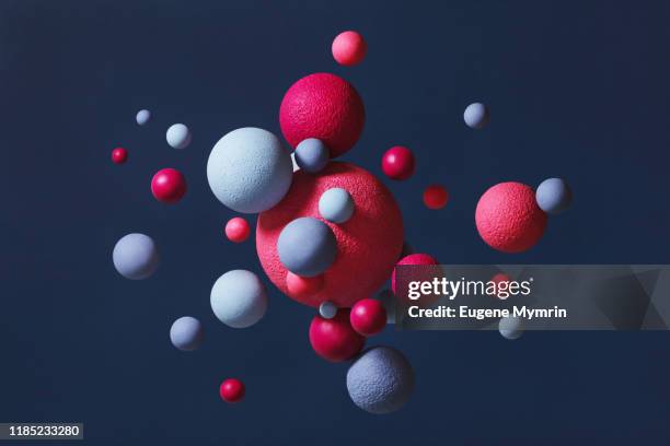 abstract multi-colored spheres on blue background - abstract molecule imagens e fotografias de stock